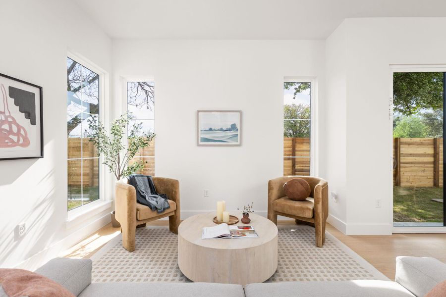 Sitting room with baseboards and wood finished floors Sitting room with baseboards and wood finished floors