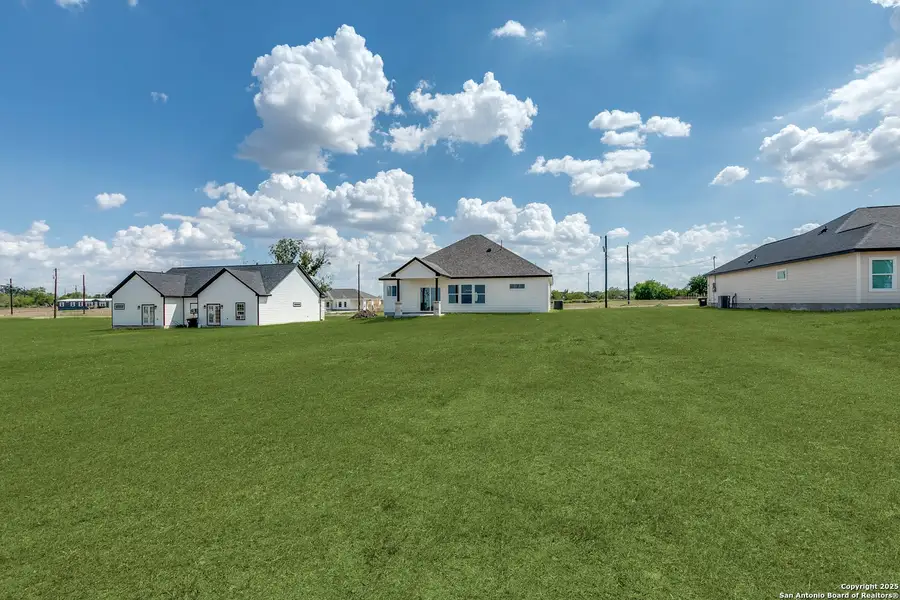 Exterior details and patio area of a home in , Atascosa (Image 4).
