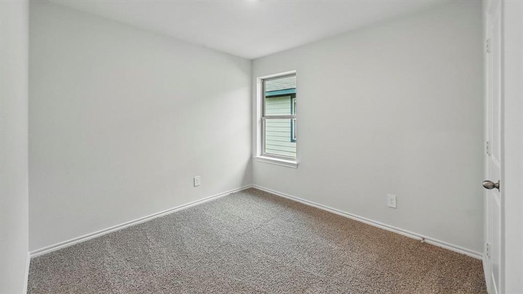 Unfurnished room featuring carpet flooring and baseboards