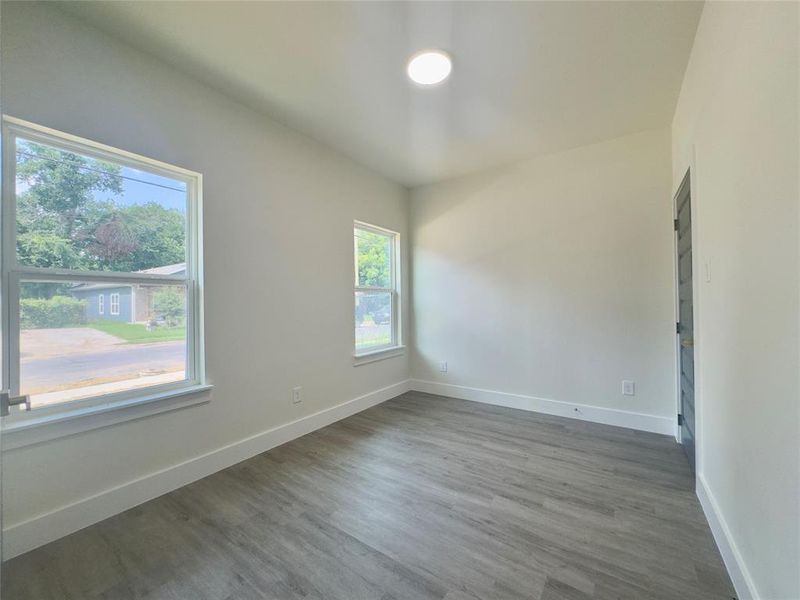 Empty room featuring hardwood / wood-style floors