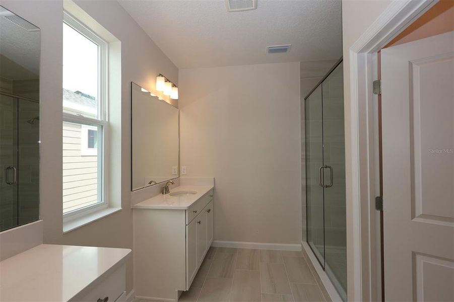 Furnished interior view inside a new home in Lake Star at Ovation, Winter Garden (Image 8).