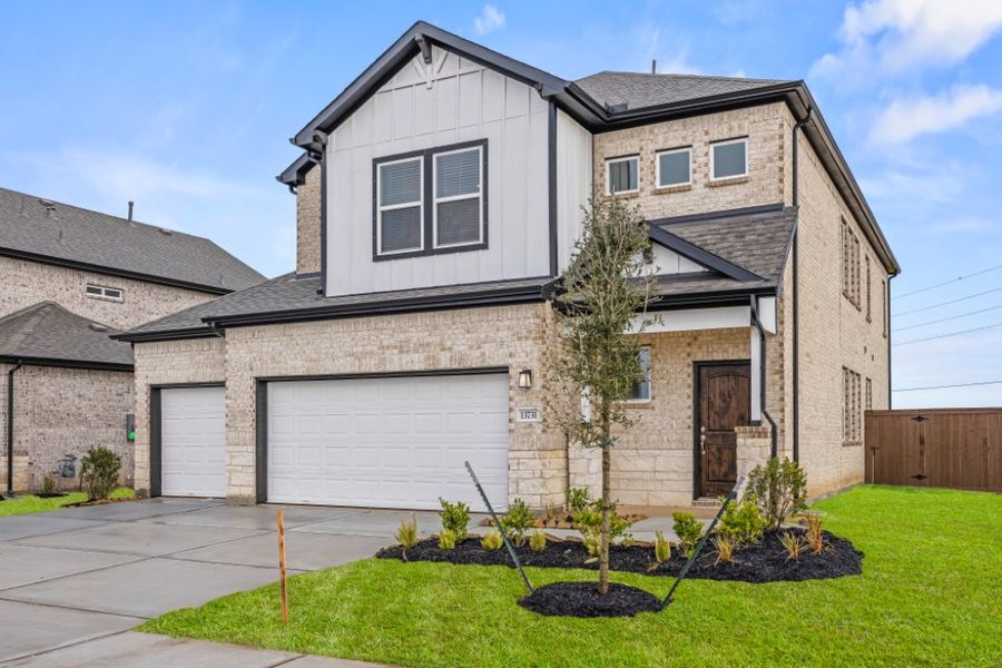 Front exterior of a new home in Creekhaven, Arcola, TX, highlighting curb appeal (Image 16).