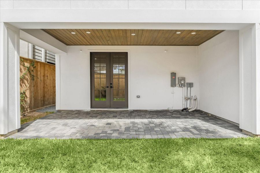 Viewed from the yard, the Pavilion's warm wood ceiling and generous covered space create an inviting outdoor retreat. Ready for your vision—whether al fresco dining, lounging, or a future outdoor kitchen—this tucked-away backyard is your own slice of city living.