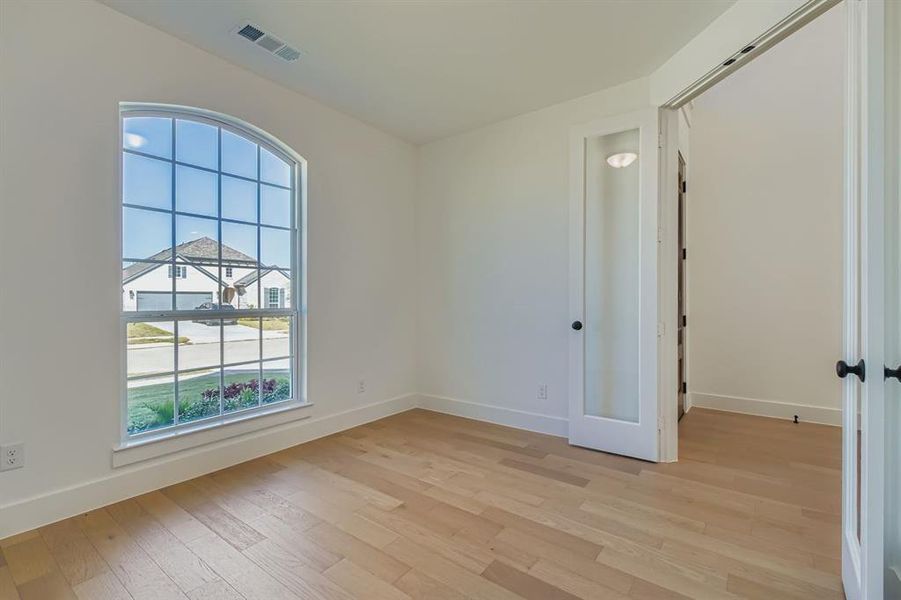 Unfurnished room with light wood-style floors