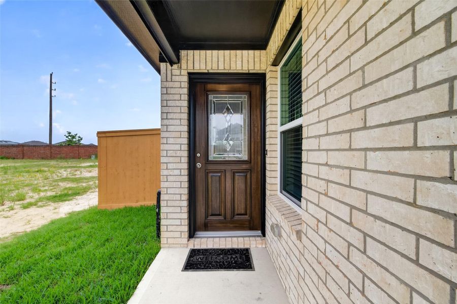 Exterior details and patio area of a home in Sunterra, Katy (Image 26).