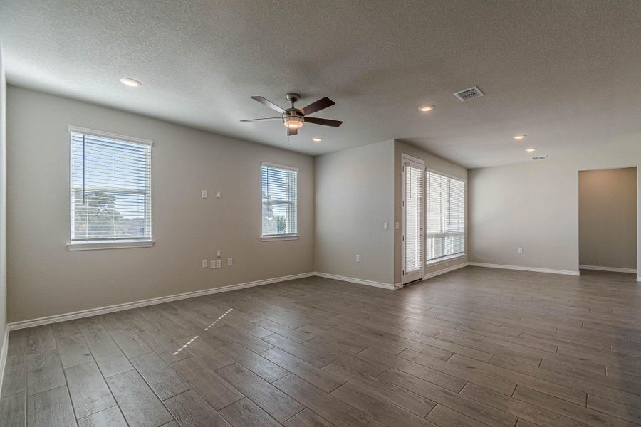 Unfurnished room with light wood-style flooring, a textured ceiling, recessed lighting, and ceiling fan Unfurnished room with light wood-style flooring, a textured ceiling, recessed lighting, and ceiling fan
