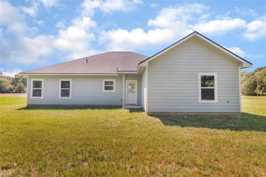 Front exterior of a new home in , Livingston, TX, highlighting curb appeal (Image 27). Front exterior of a new home in , Livingston, TX, highlighting curb appeal (Image 27).