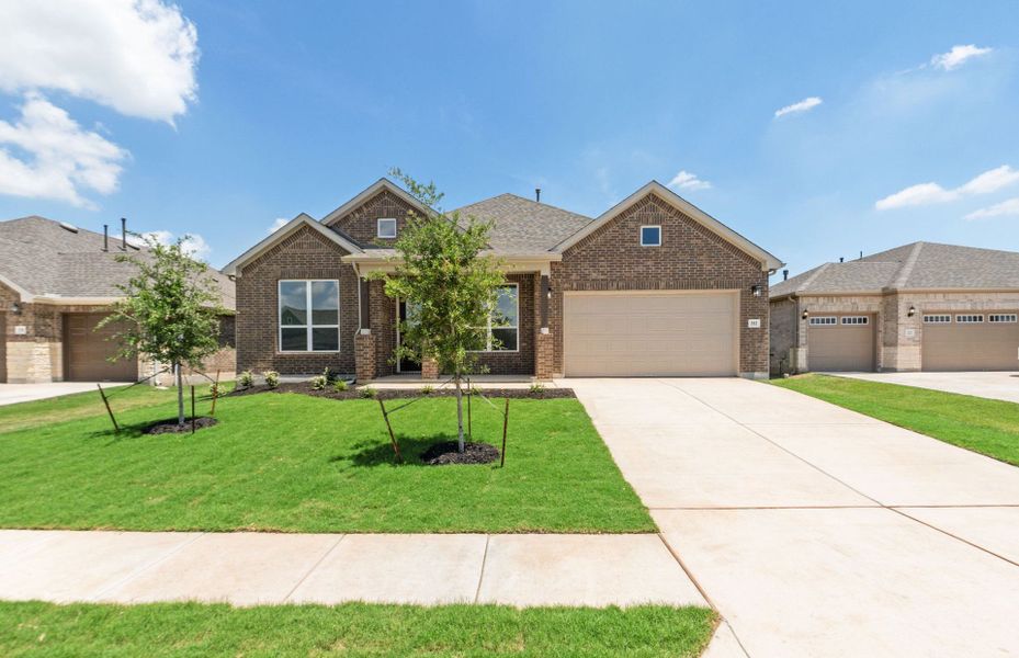 Front exterior of a new home in 6 Creeks, Kyle, TX, highlighting curb appeal (Image 20).
