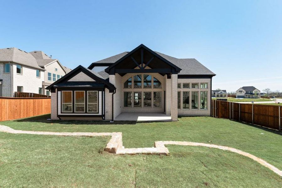 Exterior details and patio area of a home in Chatham Reserve, Providence Village (Image 25).