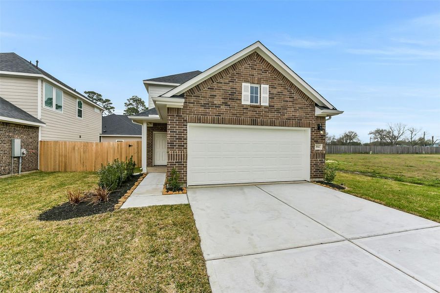 Front exterior of a new home in King Oaks Village, Baytown, TX, highlighting curb appeal (Image 2). Front exterior of a new home in King Oaks Village, Baytown, TX, highlighting curb appeal (Image 2).
