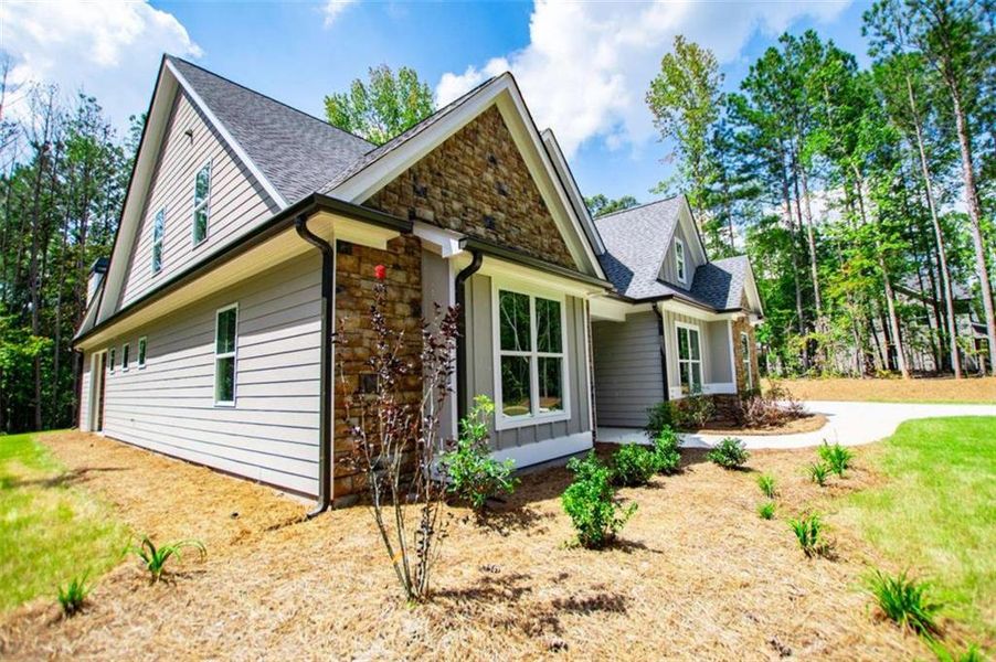 Front exterior of a new home in , Douglasville, GA, highlighting curb appeal (Image 26).