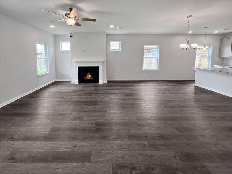 The Crawford- Family Room with Gas Fireplace. Home under construction. Sample floor plan photo used for illustrative purposes only. Upgrades, selections options, windows and colors may vary. The Crawford- Family Room with Gas Fireplace. Home under construction. Sample floor plan photo used for illustrative purposes only. Upgrades, selections options, windows and colors may vary.