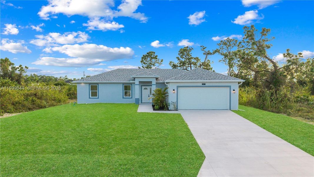 Front exterior of a new home in , Lehigh Acres, FL, highlighting curb appeal (Image 18).