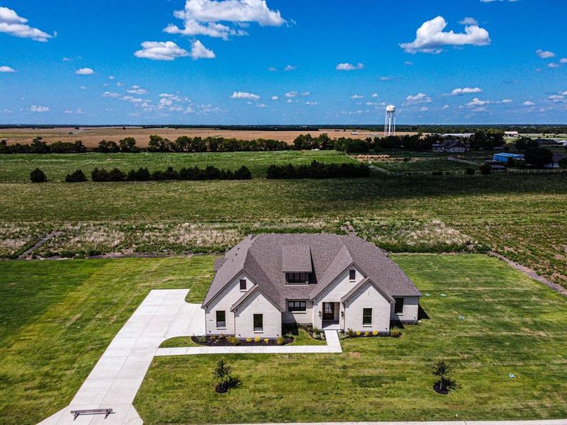Front exterior of a new home in , Caddo Mills, TX, highlighting curb appeal (Image 23). Front exterior of a new home in , Caddo Mills, TX, highlighting curb appeal (Image 23).