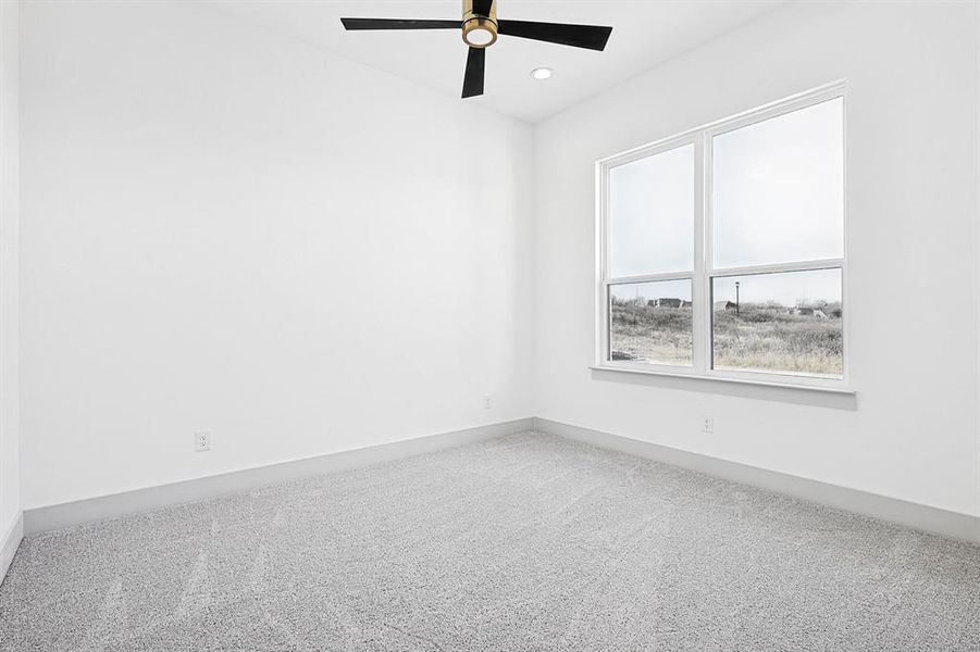 Spare room featuring carpet, ceiling fan, and recessed lighting Spare room featuring carpet, ceiling fan, and recessed lighting