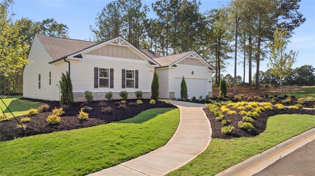 Front exterior of a new home in Bridle Creek, Locust Grove, GA, highlighting curb appeal (Image 20).