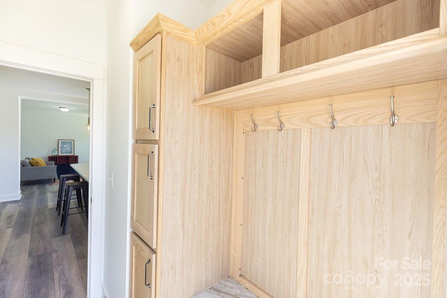Mudroom with cabinets and storage adds modern convenience