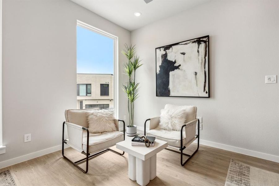 Sitting room featuring light hardwood / wood-style floors