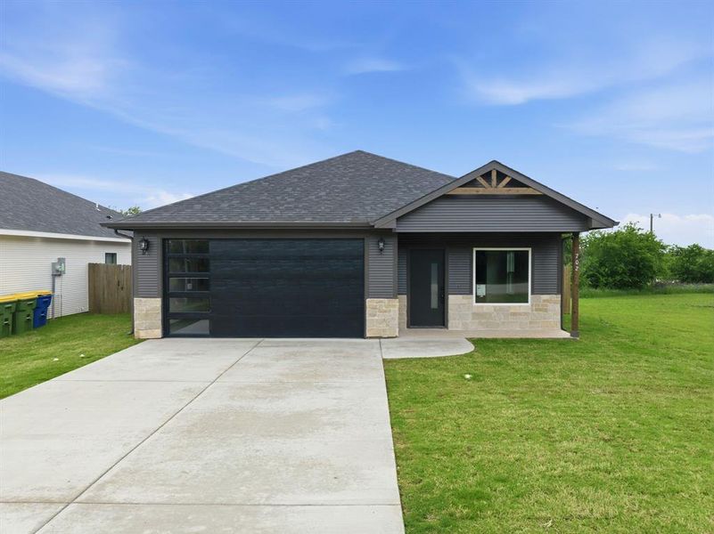 Front exterior of a new home in , Hillsboro, TX, highlighting curb appeal (Image 17).