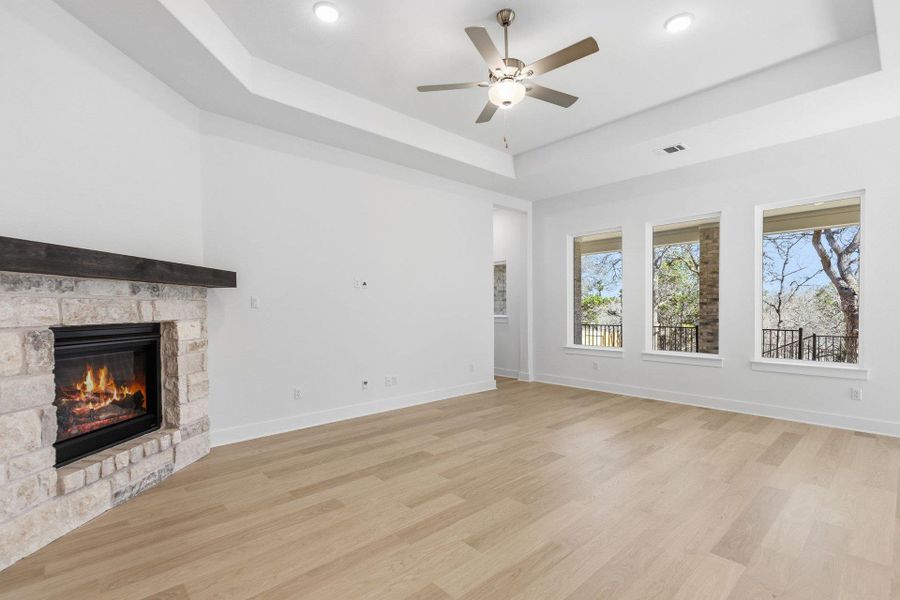 Family Room with tray ceiling & fireplace