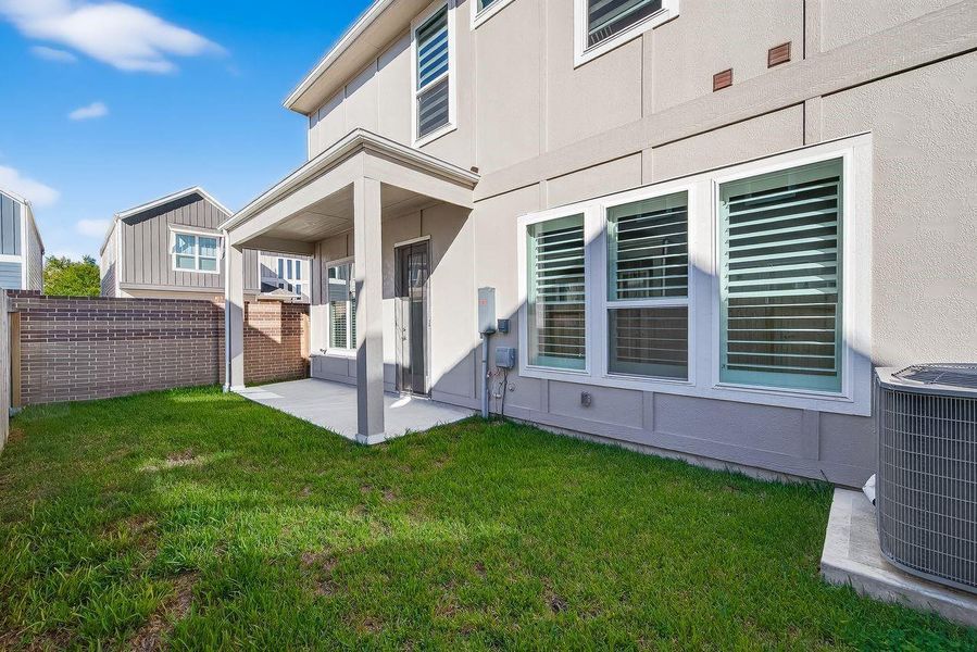 Exterior details and patio area of a home in Spring Brook Village - Luxe Series, Houston (Image 23).