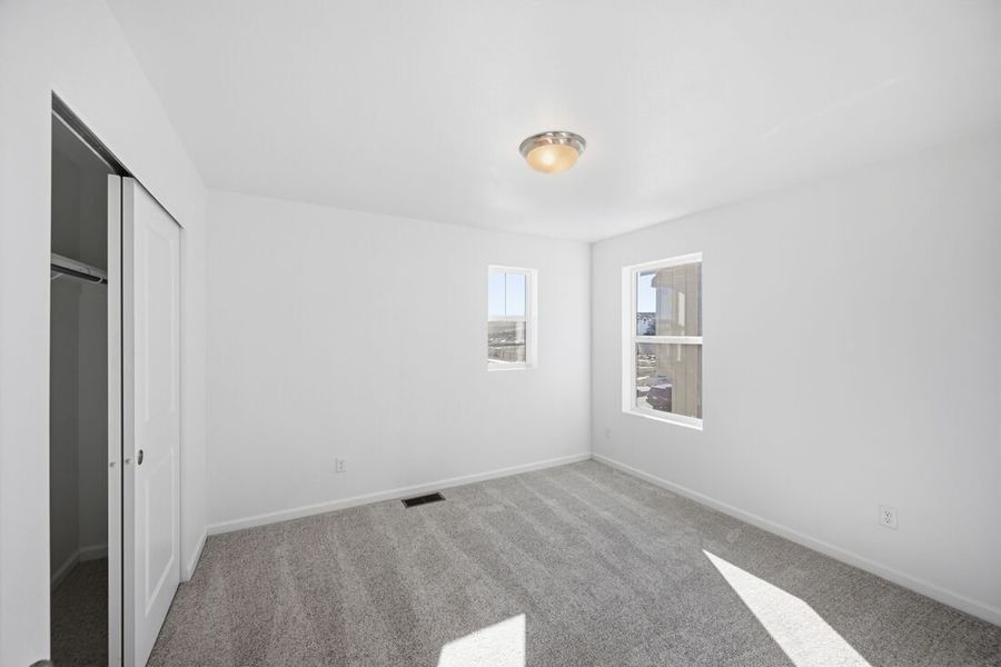 Spacious, unfurnished interior of a new home in Trailstone Town Collection, Arvada (Image 27).