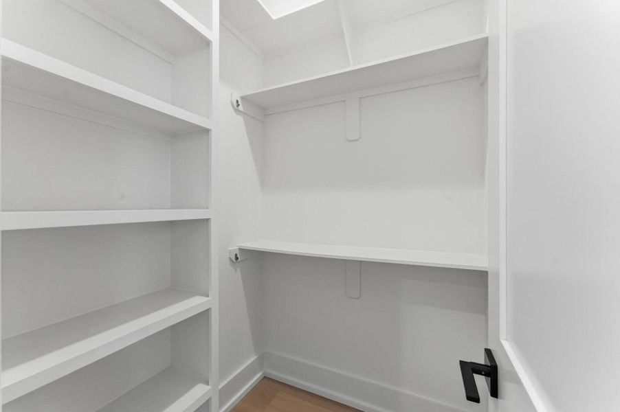 Walk-in closet in secondary bedroom