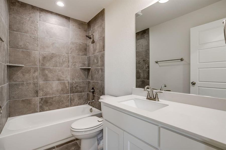 Full bath featuring vanity, tub / shower combination, and recessed lighting