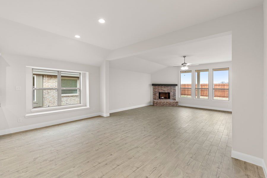 Representative exterior photo of a completed home built from the Kingston by Impression Homes in Timberbrook, Justin, TX (Image 11).