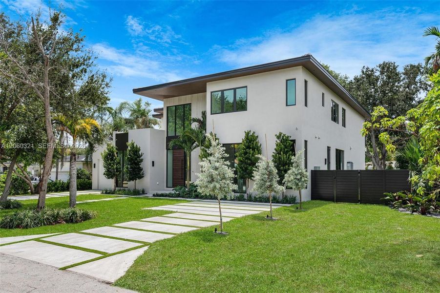 Front exterior of a new home in , Miami Shores, FL, highlighting curb appeal (Image 32). Front exterior of a new home in , Miami Shores, FL, highlighting curb appeal (Image 32).