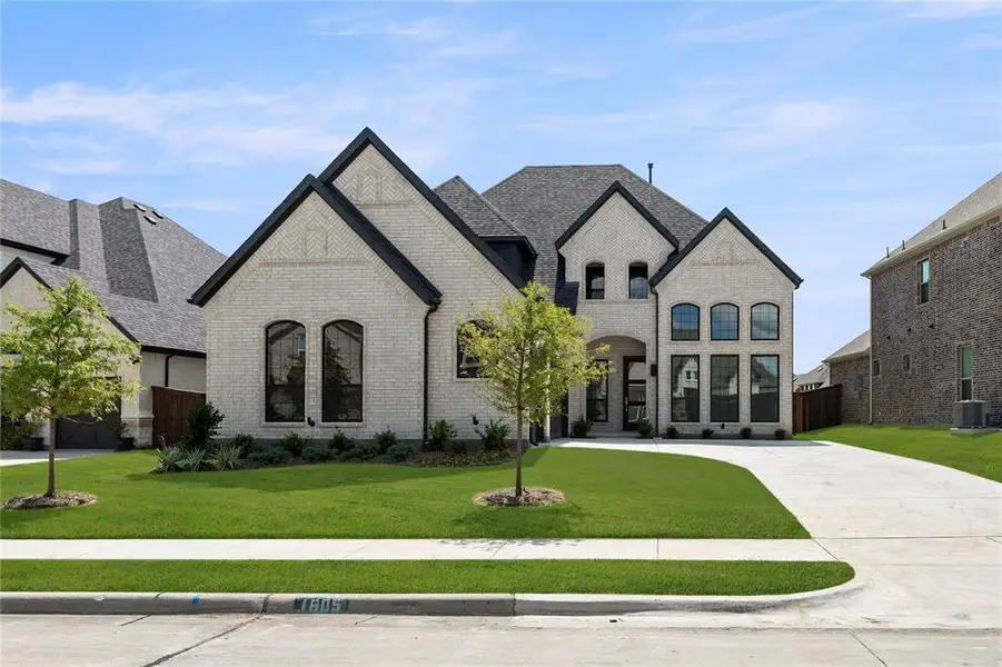 Front exterior of a new home in Gideon Grove, Phase 2, Rockwall, TX, highlighting curb appeal (Image 1).