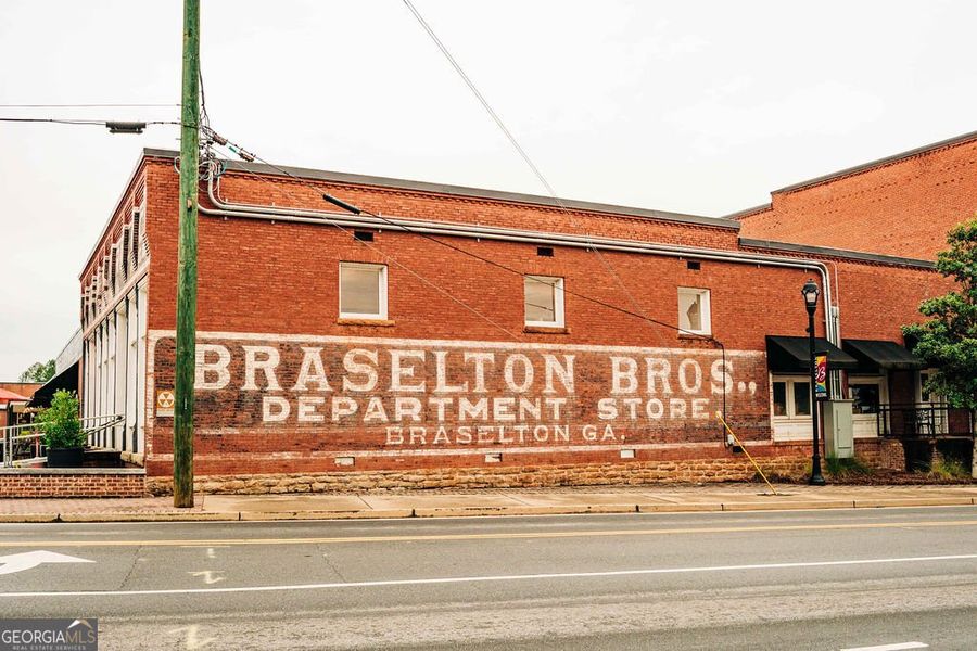 Front exterior of a new home in Rosewood Lake Estates, Hoschton, GA, highlighting curb appeal (Image 32).