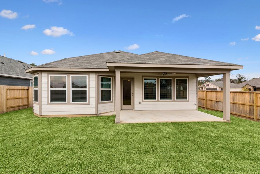 Exterior details and patio area of a home in Pinewood at Grand Texas, New Caney (Image 10).
