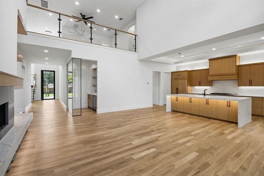 Open and bright living room and kitchen glass railing on the balcony