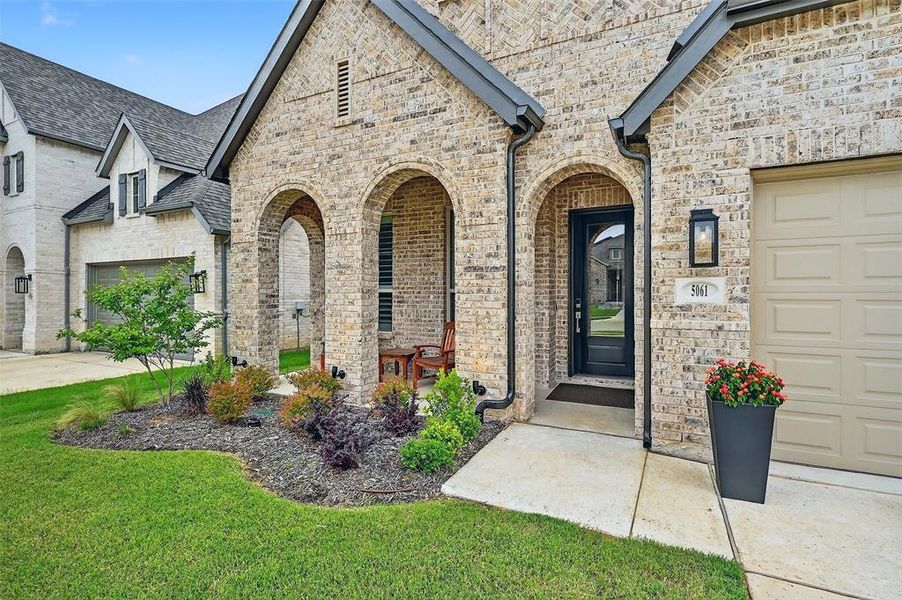 Entrance to property with roof with shingles and stone siding Entrance to property with roof with shingles and stone siding