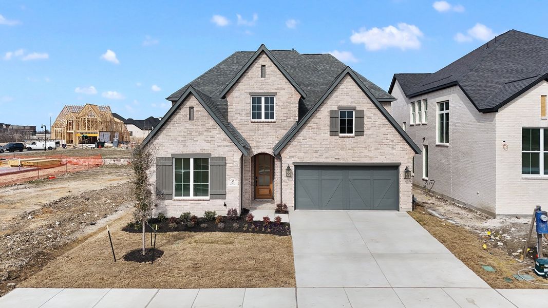 Front exterior of a new home in Hillside Village, Celina, TX, highlighting curb appeal (Image 2). Front exterior of a new home in Hillside Village, Celina, TX, highlighting curb appeal (Image 2).