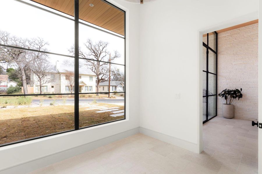 Spare room with baseboards and a residential view