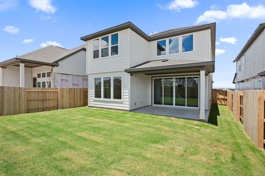 Exterior details and patio area of a home in Lariat, Liberty Hill (Image 26).