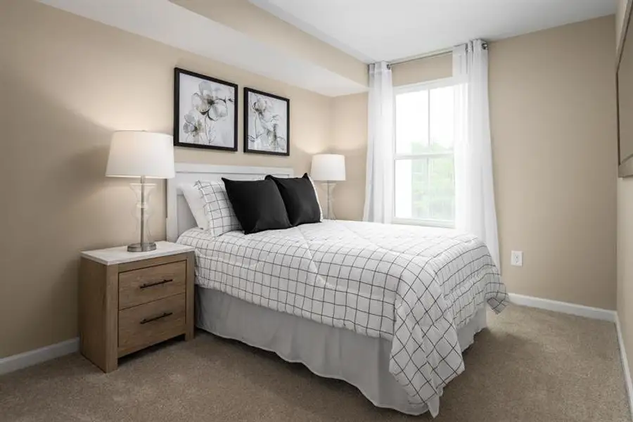 Representative furnished interior of a home built from the Beech by Ryan Homes in Highland Park Condos, White House (Image 12).