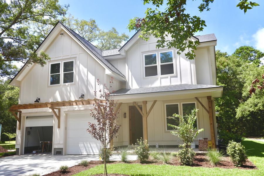 Front exterior of a new home in , Awendaw, SC, highlighting curb appeal (Image 1). Front exterior of a new home in , Awendaw, SC, highlighting curb appeal (Image 1).