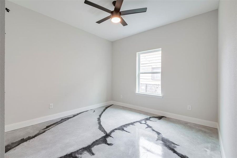 Spare room with ceiling fan