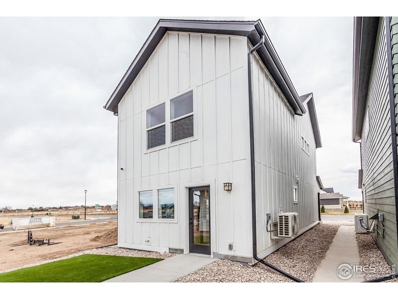 Exterior details and patio area of a home in Prairie Song Story Collection - Single Family Homes, Windsor (Image 21).