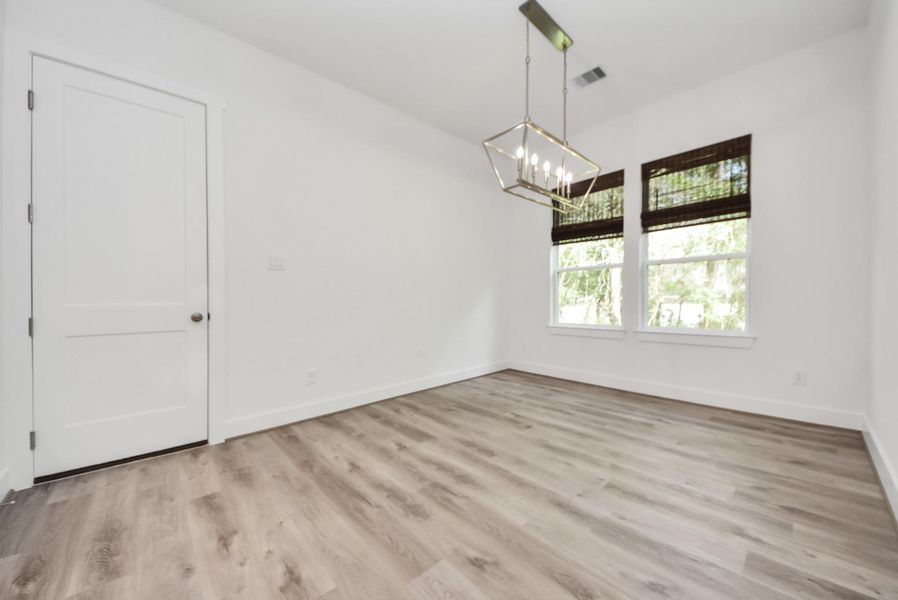 Different view of dining space with easy flow into the garage and kitchen.