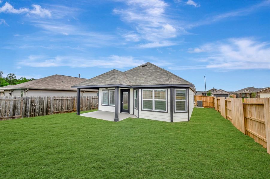 Exterior details and patio area of a home in Magnolia Ridge, Magnolia (Image 16).