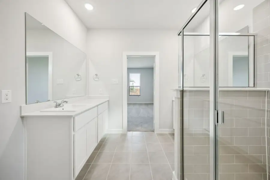 Primary Bathroom in the Masters home plan by Trophy Signature Homes – REPRESENTATIVE PHOTO Primary Bathroom in the Masters home plan by Trophy Signature Homes – REPRESENTATIVE PHOTO