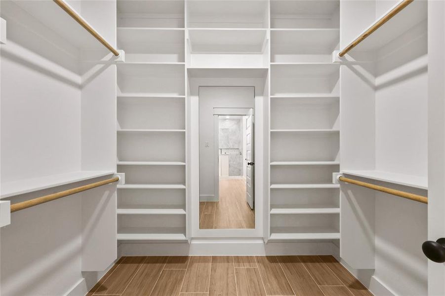 Walk in closet featuring wood tiled floors