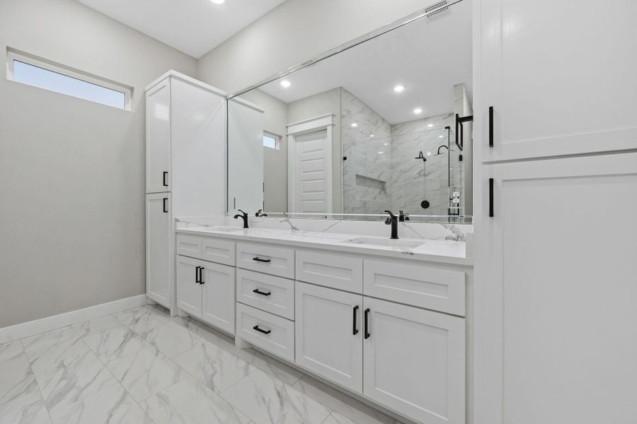 Primary vanity area with dual sinks. Primary vanity area with dual sinks.