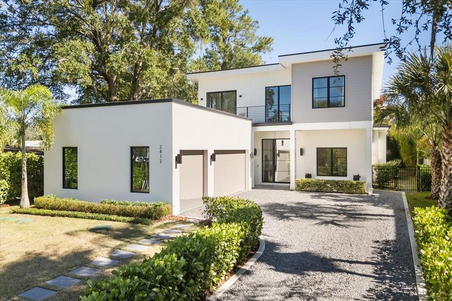 Front exterior of a new home in , Winter Park, FL, highlighting curb appeal (Image 24). Front exterior of a new home in , Winter Park, FL, highlighting curb appeal (Image 24).