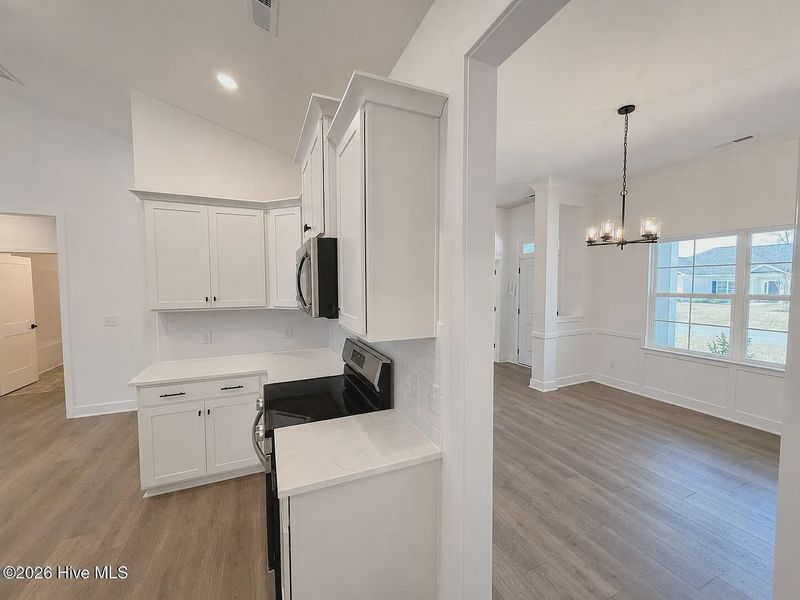 Furnished interior view inside a new home in Wood Creek Landing, Leland (Image 3).