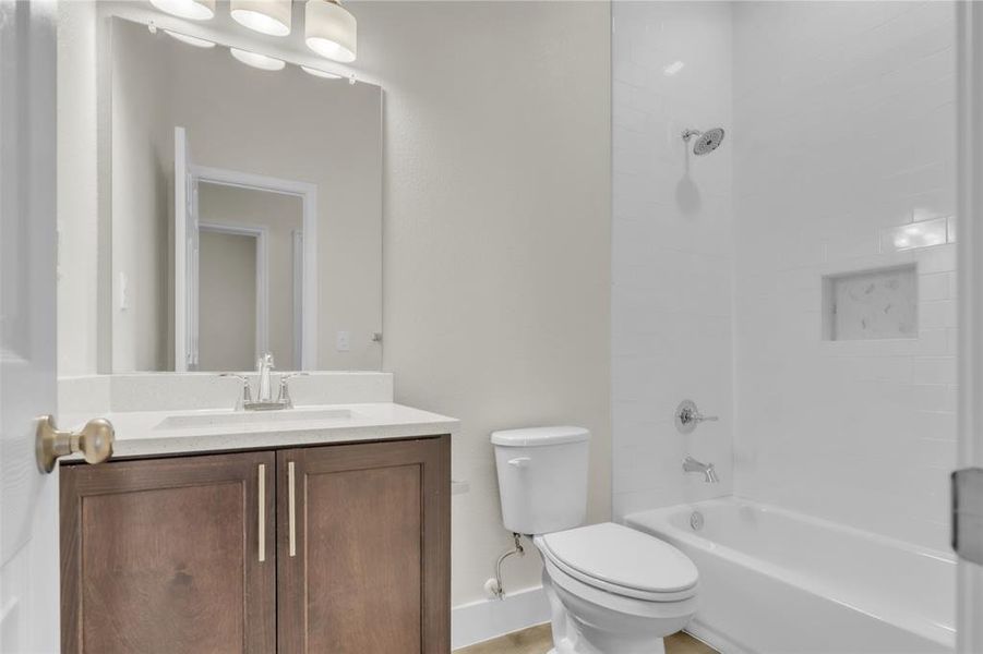 Tile to the ceiling plus quartz counters